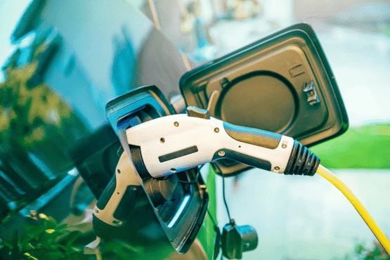 showroom displaying electric vehicles with brand badges