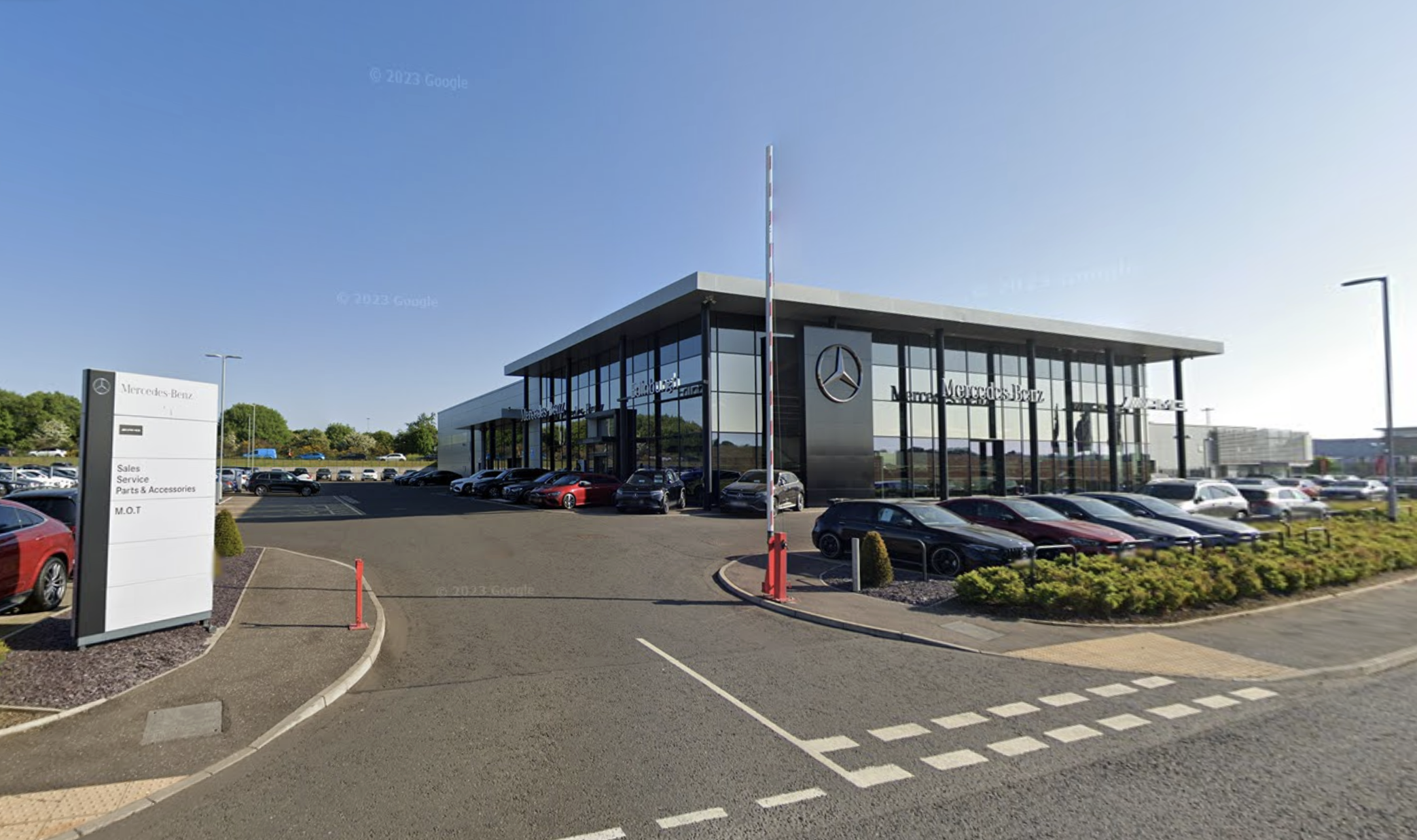 Eastern Western Motor Group showroom displaying a mix of Mercedes, BMW and new Chery vehicles