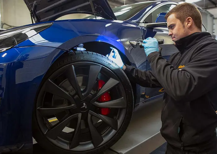 Halfords Autocentre garage with branding and service bays