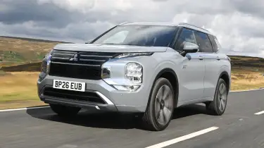 Three plug‑in hybrid SUVs displayed side by side on a test track
