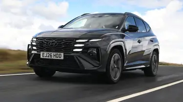 Dealer showroom showing the Hyundai Tucson, Toyota RAV4 and Mitsubishi Outlander PHEVs