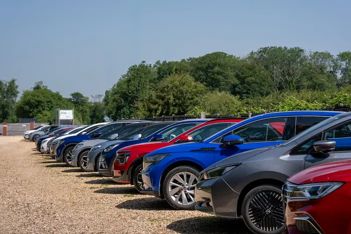 group of independent car dealers attending a used electric vehicle training session