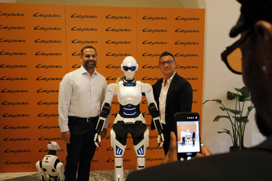 Humanoid Mornine robot and quadruped Argos robot from Chery displayed in a dealership showroom