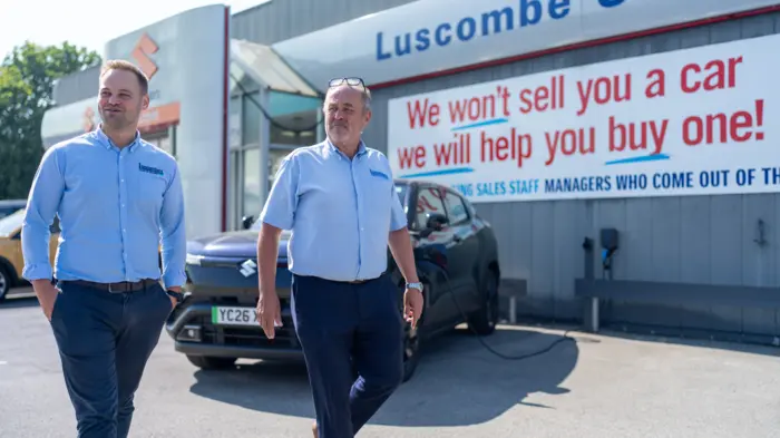 Luscombe's team reviewing vehicles on the Dealer Auction online platform