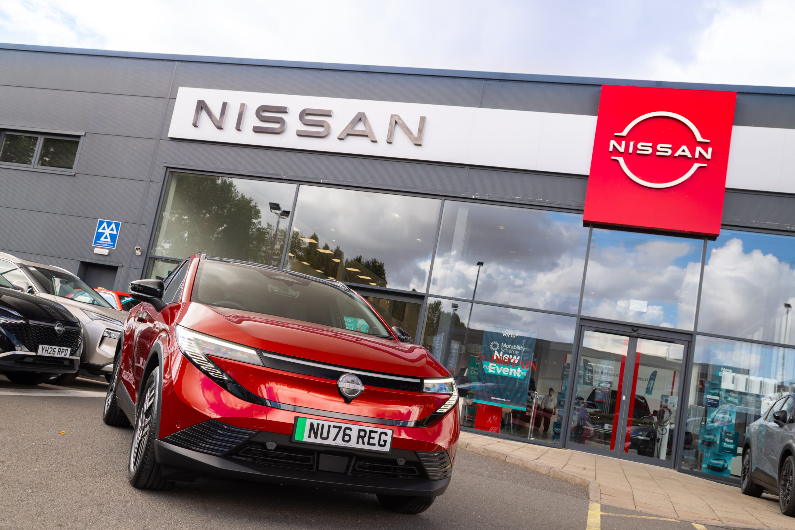 showroom display with a variety of new electric and hybrid cars