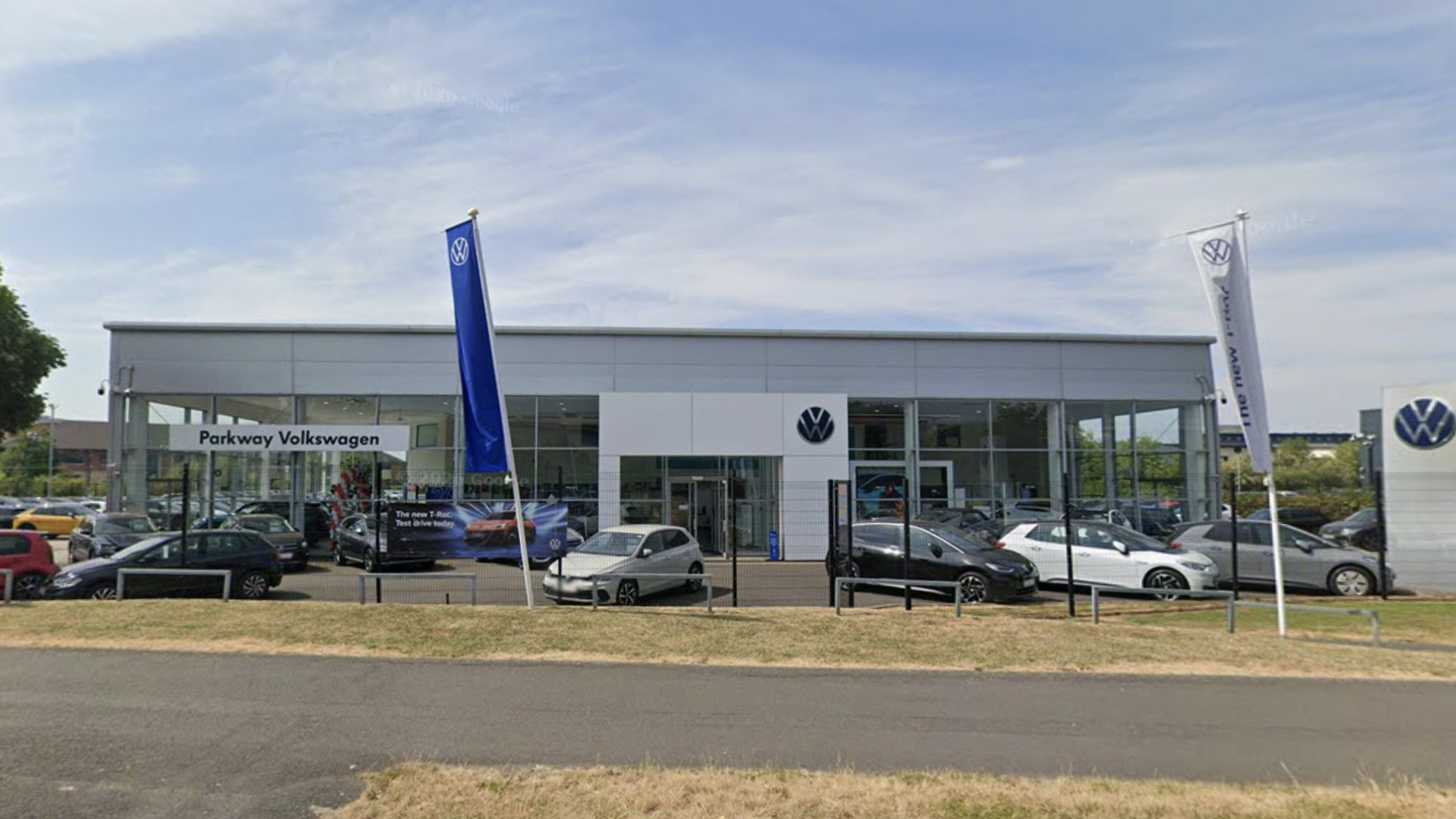 Volkswagen dealership interior with showroom floor and vehicles