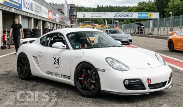 Porsche Cayman mid‑engine sports car on a race track