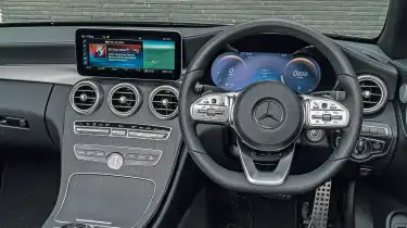 Rear three‑quarter view of a Mercedes C-Class Coupe highlighting alloy wheels