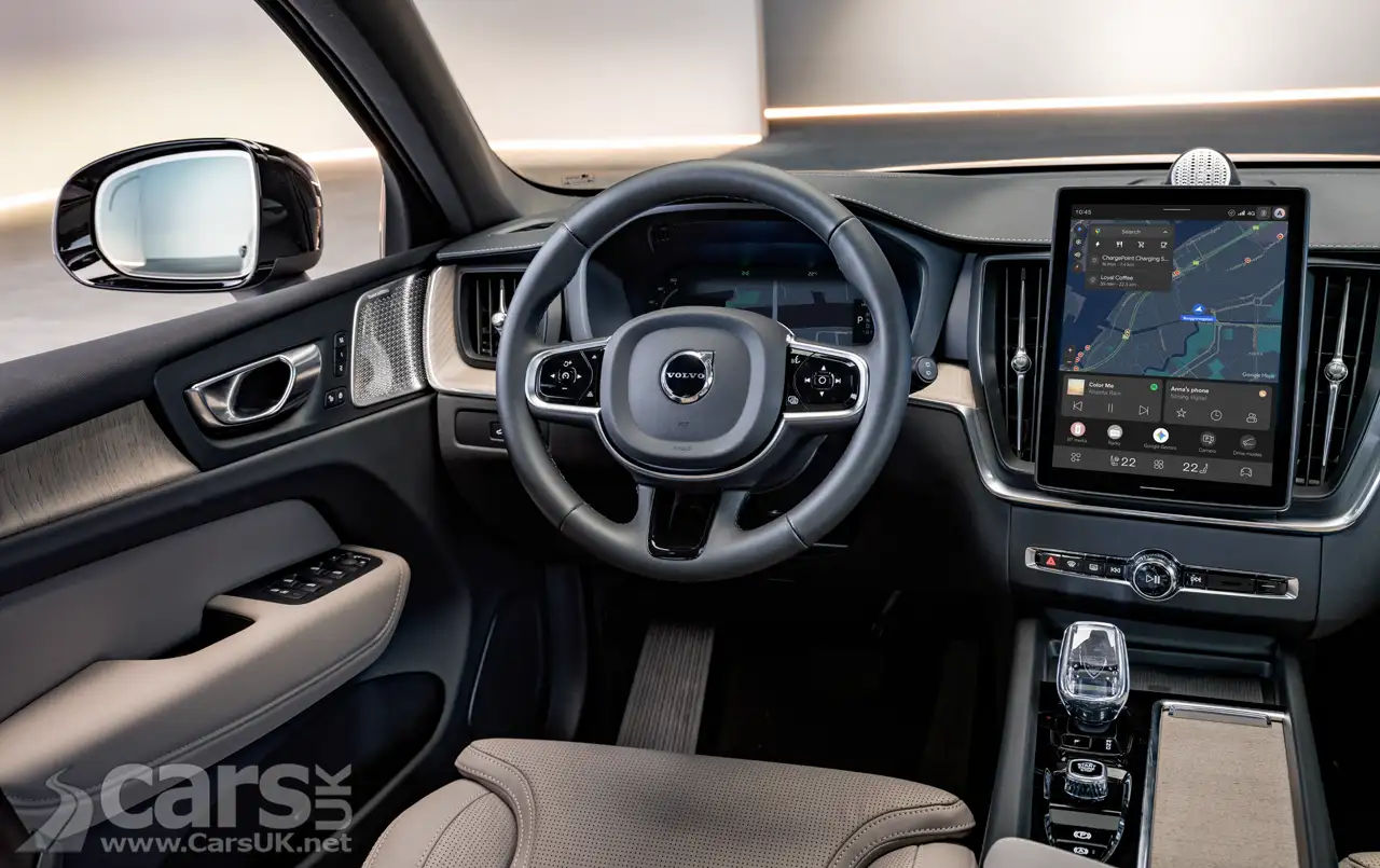 close‑up of Volvo XC60 badge and grille emphasizing updated branding details